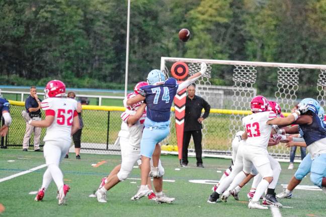 Football roundup: Vernon shuts out Dover <b>The ball is batted away by Sparta defensive tackle Ryder Chlodnicki (74) resulting in an incomplete pass by Lakeland in the first half.</b>
