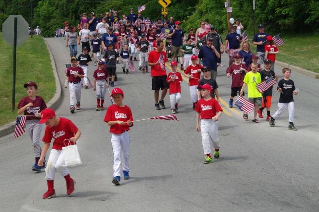 Members of Vernon Little League march during the parade.