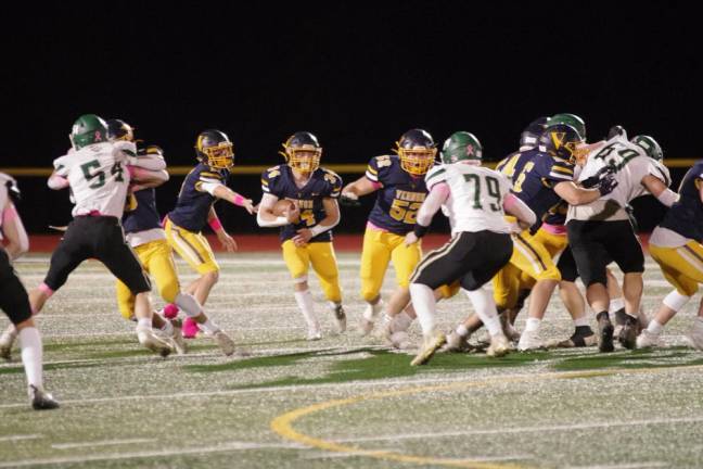 Vernon ball carrier Logan Pych moves toward an opening.