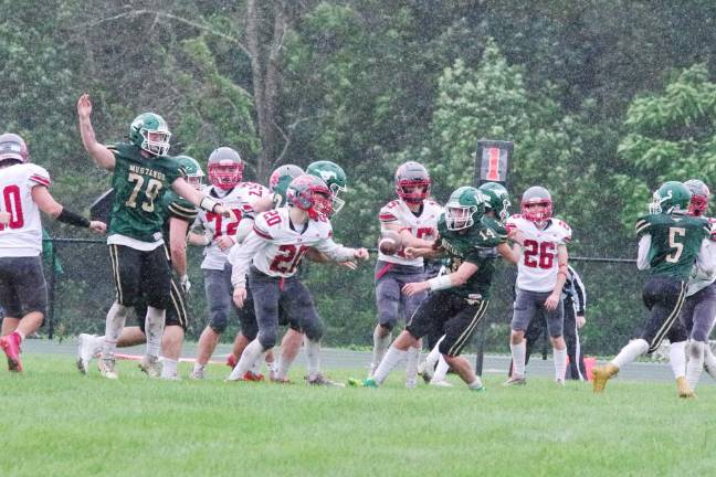 Newton leads division The ball is up for grabs after it was knocked loose from a Sussex Tech running back in the first half.