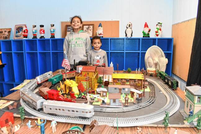 Photos: Holiday Train Display Madi and Jared Hackett of Clifton watch a model train move around the track.