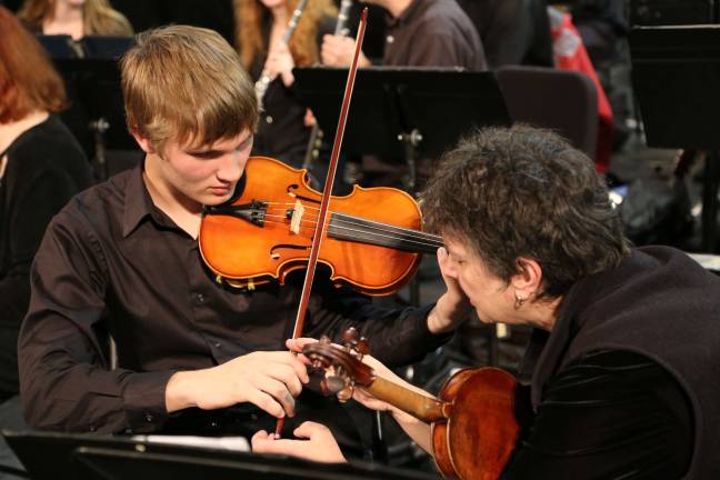 Vernon high school orchestra rehearses with pros Trevor Hazell on Violin.