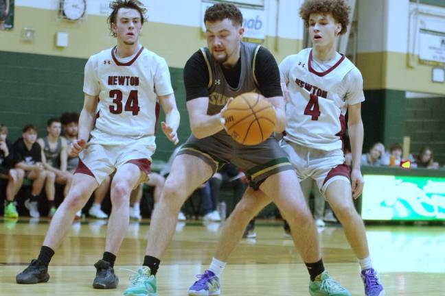 Sussex Tech's Dane Walker handles the ball. He scored seven points and grabbed 14 rebounds.