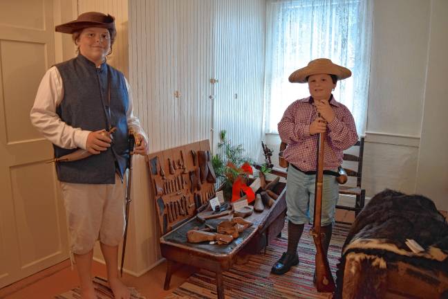 A trip back in time <b>The Ziccardi brothers August, 11, and Heath, 10, by a cobbler’s bench with tools and old shoes in the DAR Van Bunschooten Museum in Wantage. (Photos by Theresa Esposito)</b>