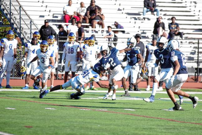 New era for SCCC football <b>Sussex Skylanders ball carrier Jabron Solomon swerves in an attempt to avoid a Monroe University defender in the season-opener Aug. 30. SCCC lost, 28-6. (Photos by George Leroy Hunter)</b>