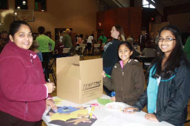 Left is San Ranasinghe with daughters Lomaaani, 14, and Suvanni, 10.