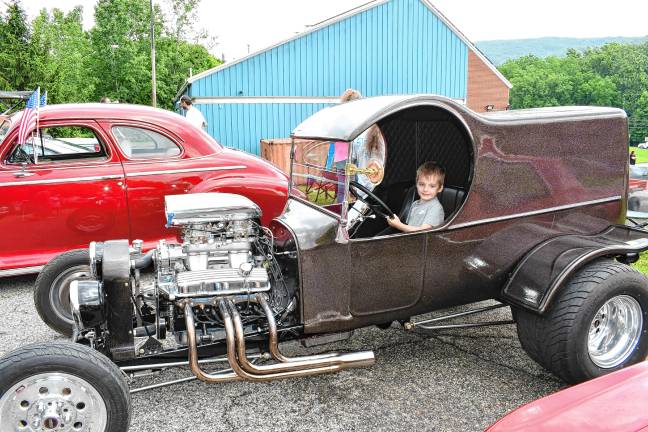 Photos: 2nd annual Car Show in Vernon <b>Wesley Walters of Vernon poses in one of the cars on display.</b>