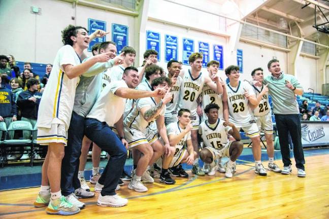 The Vikings pose for photos after their victory.