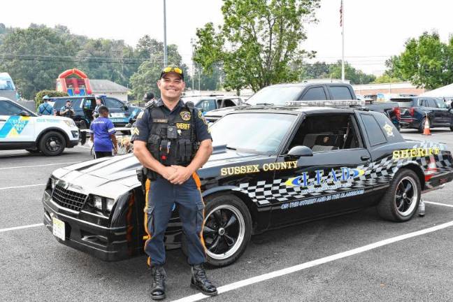 Photos: National Night Out in Sussex County Sussex County Sheriff’s Officer James Aumick poses at National Night Out in Newton.