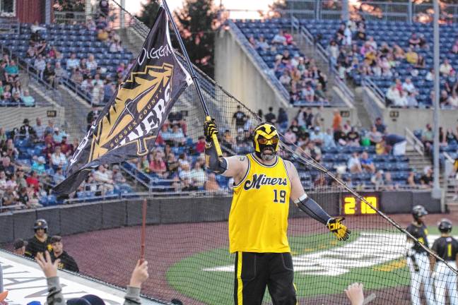 UPDATED: Miners make playoffs <b>Miner Man carries the team flag.</b>