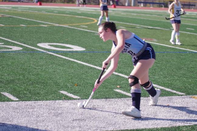 Shea Cina of Sparta drives the ball.