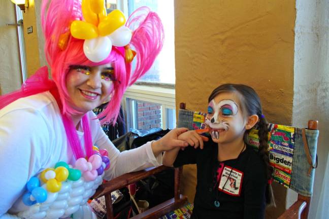 With several face-painting themes available, Mina Brock, 6, chose a combination of a skull and a bunny. Face painting was once again provided by Kerry Tobin of Highland Lakes, better know as Pixie Pop the Clown.