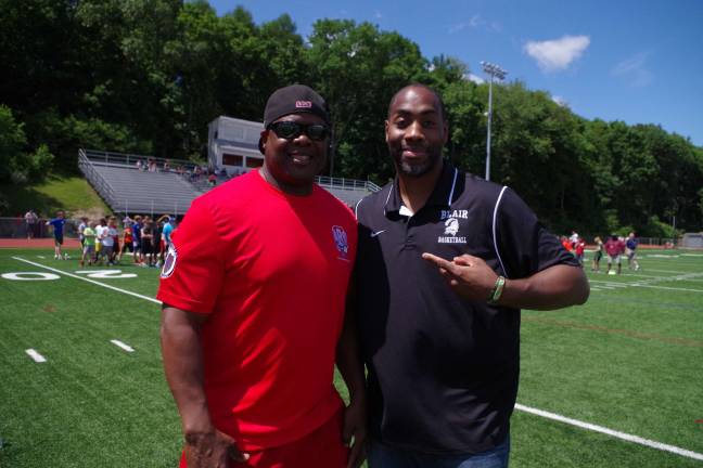 Children gather to punt, pass and kick Former NY Giants running back Lee Rouson and Blair Academy assistant basketball coach Cornell Thomas at the Punt, Pass and Kick event in Newton.