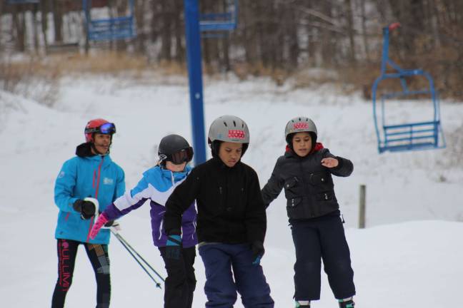 Children from New York City YMCA branches hit the slopes at the beginner trail of the former Hidden Valley Ski Area in Vernon this past weekend. The mountain is being renamed the National Winter Activity Center. Photo provided.