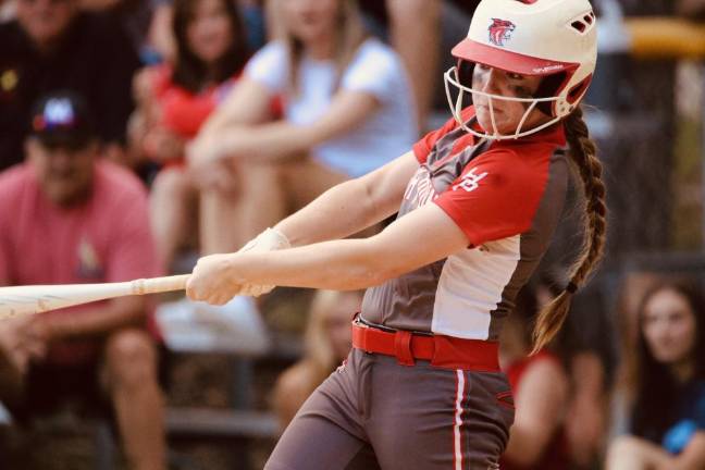 Junior Mikayla Conklin swings the bat.