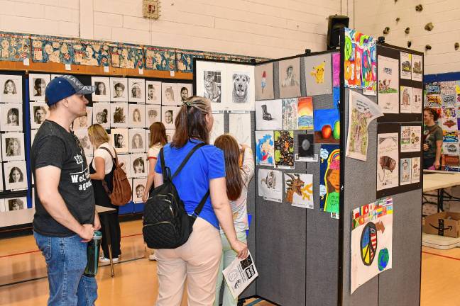 Photos: Artstanding 2025 in Vernon <b>Residents look at student artwork during Artstanding 2025 on Friday, May 16 at Lounsberry Hollow Middle School in Vernon. </b>
