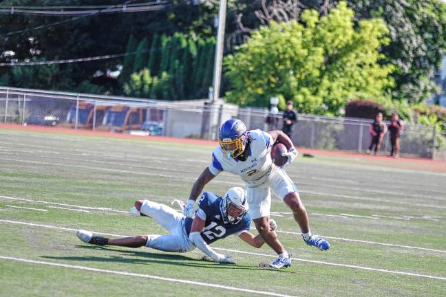 New era for SCCC football <b>A Monroe ball carrier tries to evade a Sussex defender.</b>