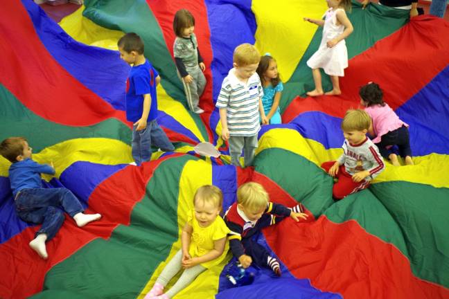With all the activities planned for them that morning at BumbleSong music class, everybody&#xfe;&#xc4;&#xf4;s favorite seemed to be playing on or under the multicolored parachute.