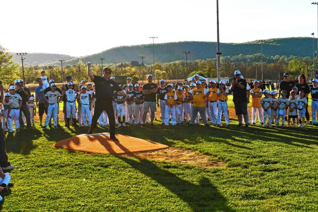 Photos: Little League opening night in Vernon <b>Mayor Anthony Rossi throws the first pitch on the Vernon Little League’s opening night Friday, May 2 at Veterans Memorial Park. The field has a new lighting system. (Photos by Maria Kovic)</b>