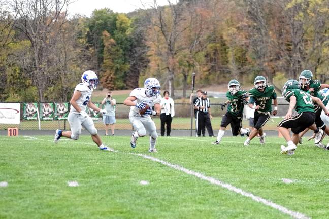 Wildcats claw Patriots, 35-6 <b>Kittatinny's Niko Martinez carries the ball as several Sussex Tech defenders close in. He made a touchdown in the second quarter.</b>