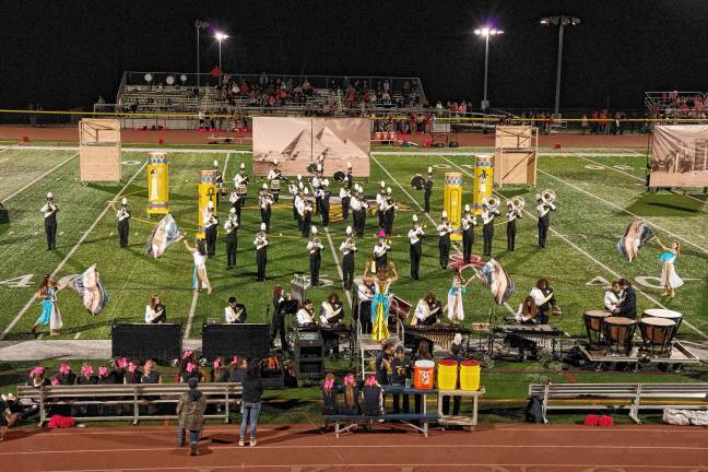 Football roundup: Vikings slay Wildcats, 35-28 <b>The Vernon Township High School Marching Band and Color Guard perform during halftime. The performance theme was based on ancient Egyptian culture.</b>