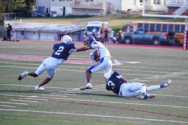 New era for SCCC football <b>Sussex defenders work in tandem to bring down a Monroe ball carrier.</b>