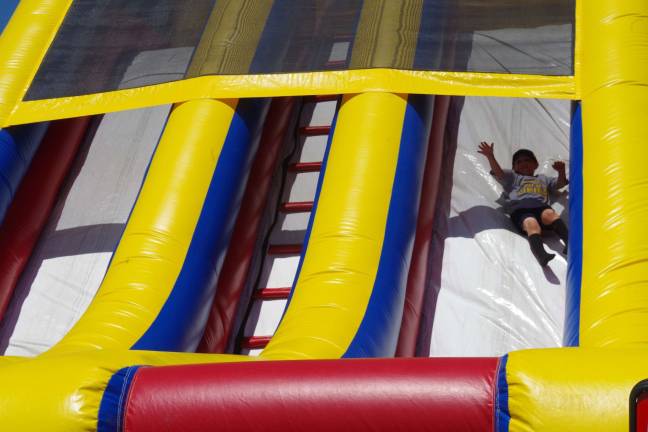 The Vernon PAL slide was one of three inflatable attractions for the children at the annual Vernon Day event held at Maple Grange Park.