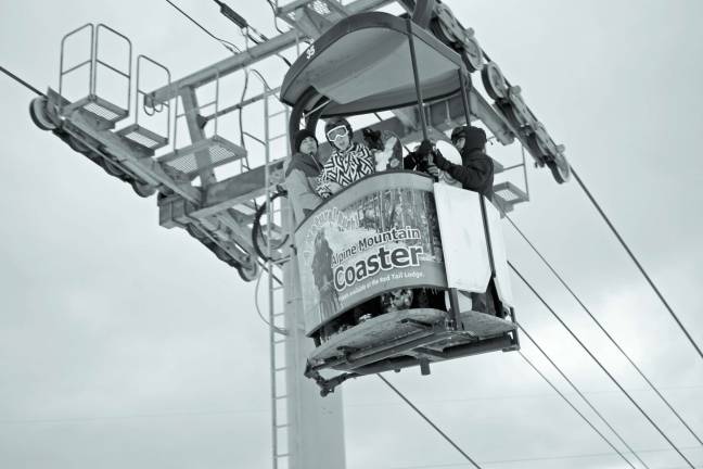 Mountain Creek embraces early snowfall, snowmaking Happy snowboarders on the Cabriolet lift.