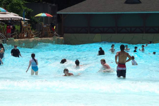 PHOTO BY CHRIS WYMAN Visitors are shown enjoying the up and down motion of the Hightide Wavepool at Mountain Creek Water Park last summer. The resort's ownership filed for Chapter 11 bankruptcy protection on Monday.