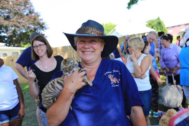 Zoo Mama Lori Space Day with eleven day old Tiger cub on Junior Zookeepers Day.