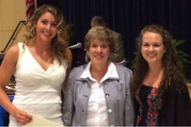 Jinan Andres, left, and Morgan Perich are shown with Vernon Woman's Club President Judy Filippini, center.