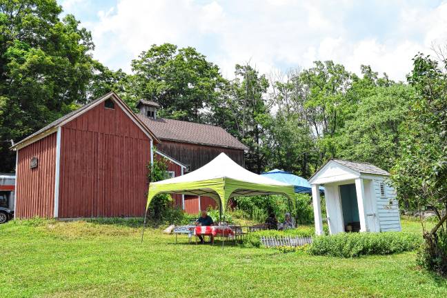 A trip back in time <b>A tent and outside seating are set up for lunch and treats between the ice barn and the privy.</b>