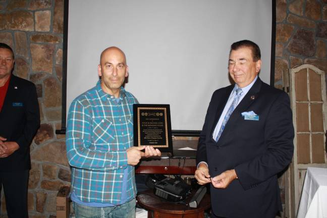 Responders support group presents scholarships Steve Scro, owner of Mohawk House, receives an award from Pat Aramini for his support of The 200 Club of Sussex County.