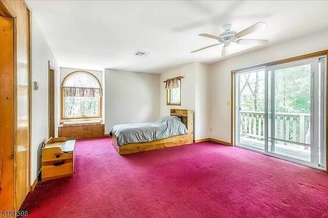 Private splendor in intimate lake community 63 Beaver Run Road