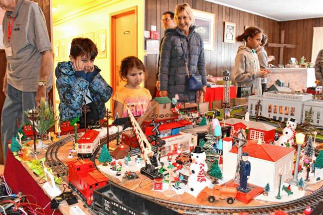 Photos: Holiday Train Display <b>Luke and Maggie Gibson of Oak Ridge look at the Holiday Train Display on Saturday, Nov. 23 at Prince of Peace Lutheran Church in Hamburg. The display was set up by the Sussex County Railroad Club. (Photos by Maria Kovic)</b>