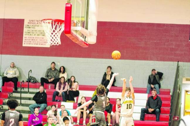 West Milford's Ognjen Ljusic (10) launches the ball from afar. He scored 14 points.