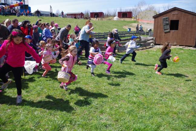Youngsters start the Easter Egg hunt at Heaven Hill Farms in Vernon.
