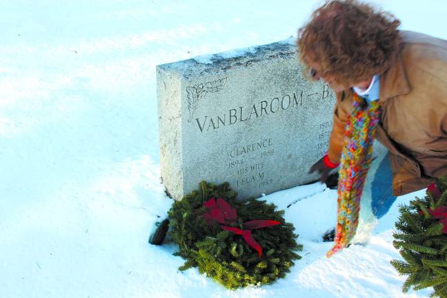 DAR brings Wreaths Across American to county DAR member Allyn Perry lays a wreath at a grave as partnered with the group's affiliation with Wreaths Across America.
