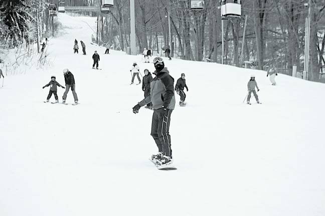 Mountain Creek embraces early snowfall, snowmaking Snowboarders and skiers together on the slopes.