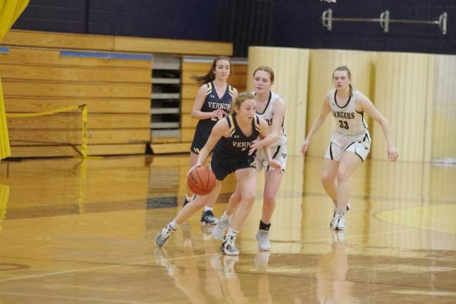 Vernon's Grace Duffy handles the ball. She scored two points and grabbed three rebounds.