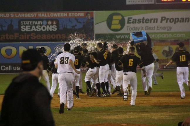 The Sussex County Miners celebrate a 10th inning win over Fargo after Jon Dziomba's walk-off single Satuday night. Photo by Taylor Jackson