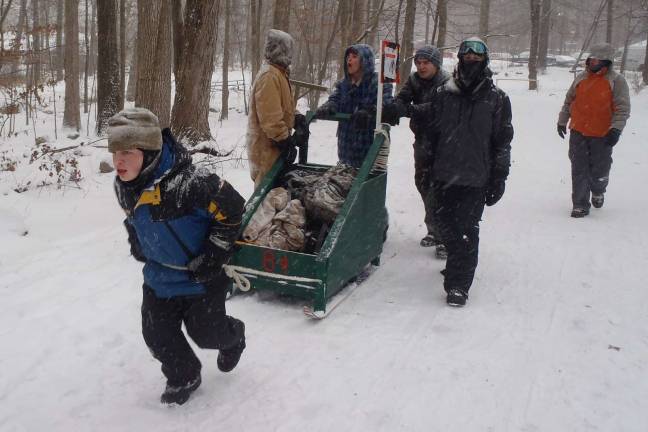 Troop 84 attends Klondike Derby Boy Scouts pull the sled to the next station.