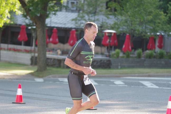 Forty-two-year-old triathlete James Smith, of Washington Crossing, Pennsylvania, earned first place overall with a time of 1:03:49.53.