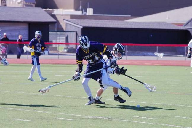 A Vernon Viking and a Delaware Valley Warrior battle for control of the ball (Photo by George Leroy Hunter)