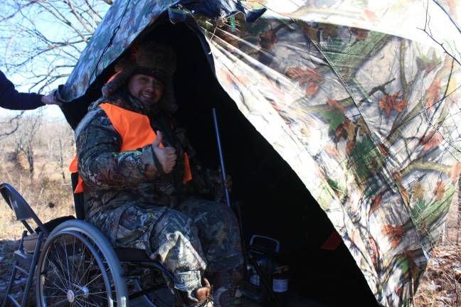 Refuge offers hunting chance for disabled sportsmen Edward Afandador gets situated in his blind.