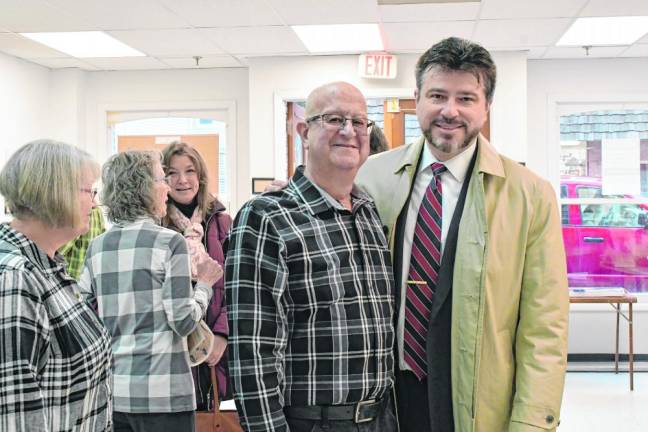 Mario Poggi, left, poses with Robert Kovic.