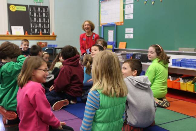 Wantage School hosts celebrity readers Allyn Perry of the DAR Museum shares a story with students.