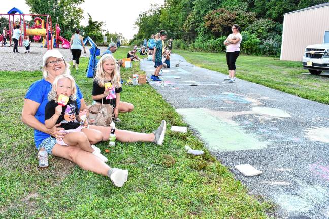Photos: Sidewalk Chalk Art Festival in Vernon <b>Elle Savela, Eileen Prisco and Reese Savela take a break for ice cream.</b>