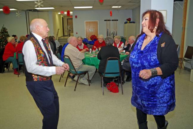 Vernon seniors celebrate holidays Friends Frank Macherone and Rose Moro are shown on the dance floor.