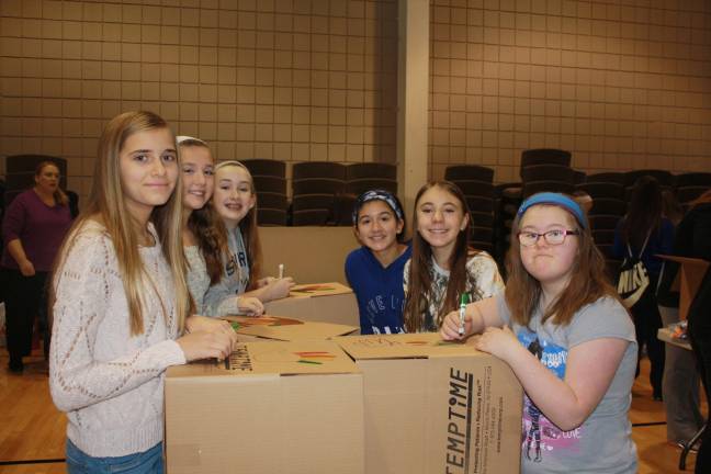 Family Volunteer Day brings out community Seventh graders from Sparta Middle School, left side, Rachel Sasik, Jessica Firzlaff and Stephanie Villar; Right side, Kelsi Loewen, Natalie Kruyds and Katie Carrigan.